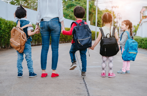 mom walking children to school