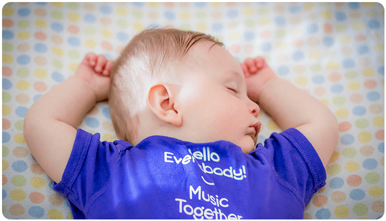Baby asleep with eye closed