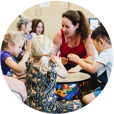 Sarah Walker with Class around Gathering Drums (Photographer: Janine Sheen Photography)