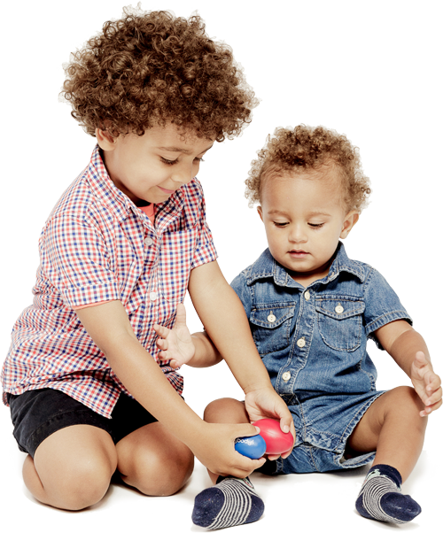 siblings playing with egg shakers