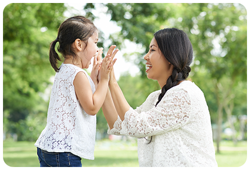 Mom and Daughter Playing Pattycake